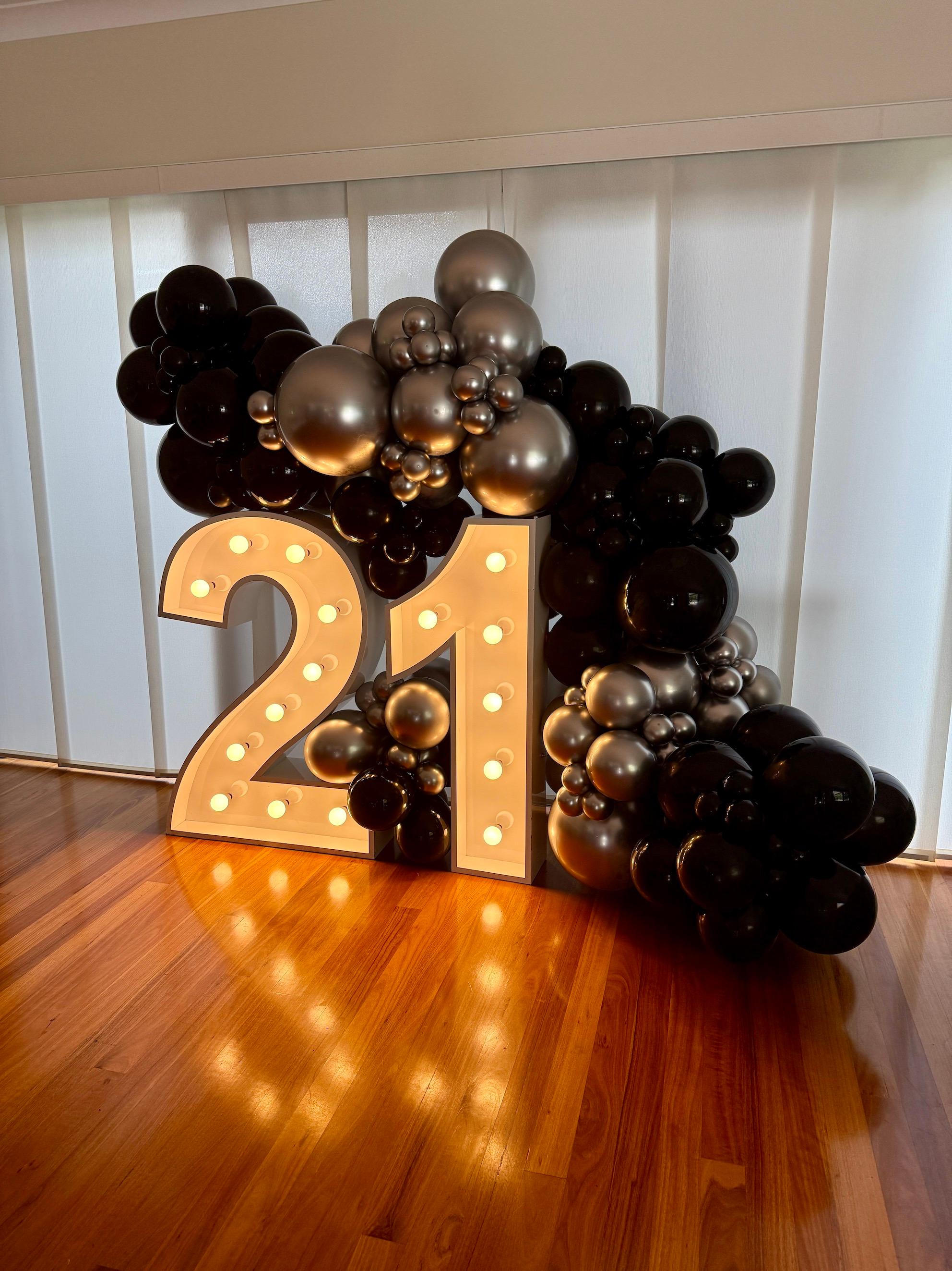 Black and silver balloon garland with light up numbers Brisbane