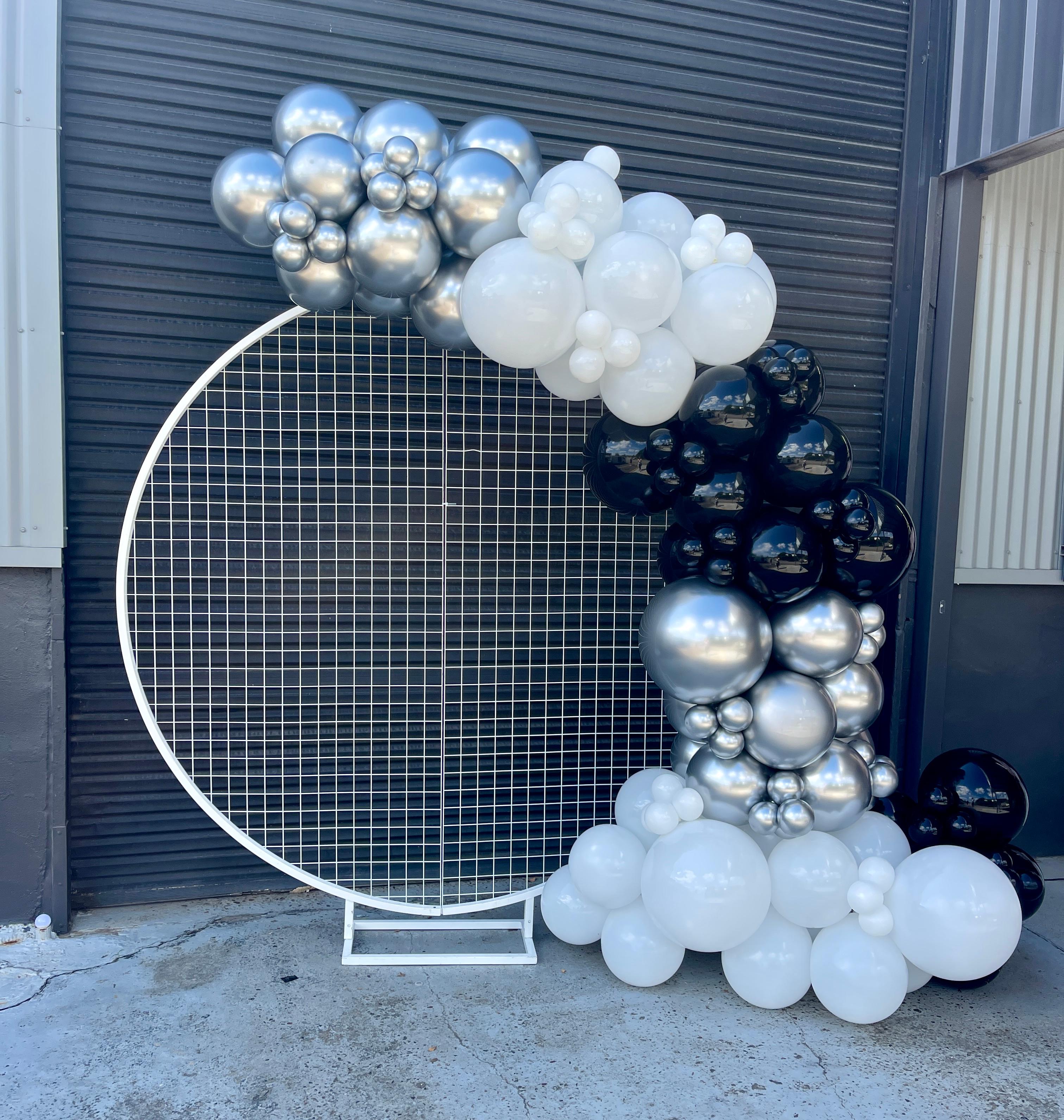 black white and silver balloon garland