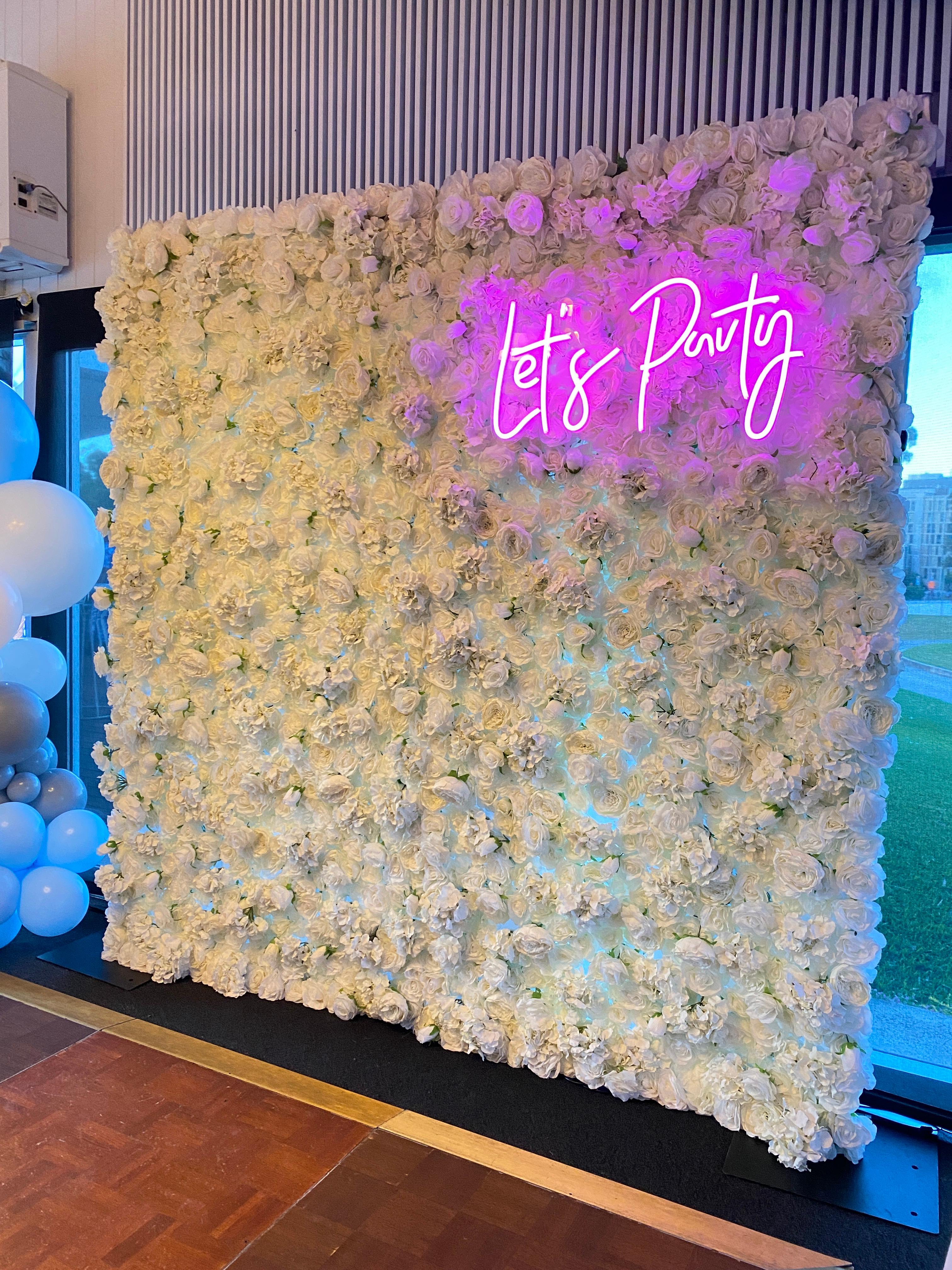 Flower wall and neon sign